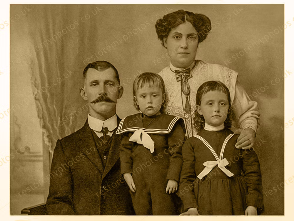 The same 1900s family portrait after restoration and tonal recovery